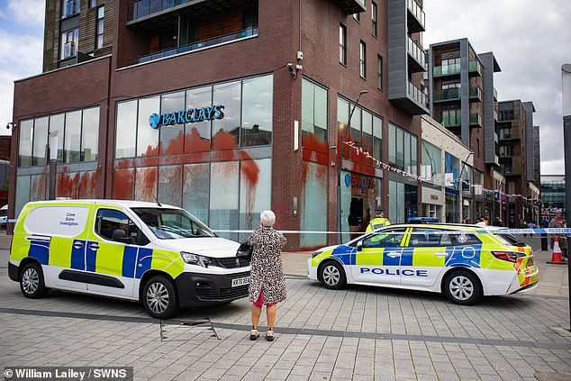 BURY: Forensic officers and a police cordon were present outside the Barclays bank in Bury, Manchester, this morning after the group attacked the bank with paint