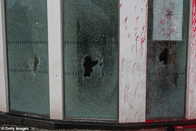 CROYDON: Holes can be seen in broken windows in Croydon this morning