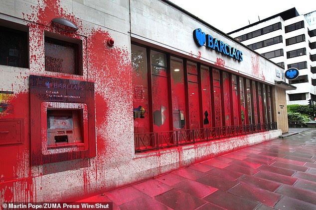 WESTMINSTER: Barclays Bank's St Johns Wood branch is left with its doors and windows smashed and the exterior covered in red paint