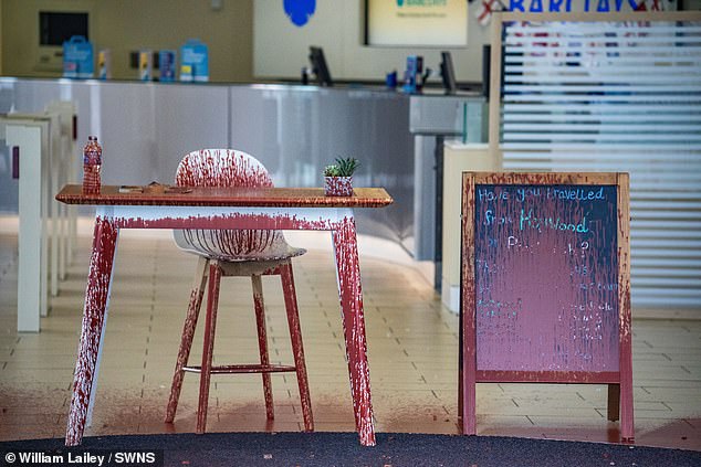 BURY: A table and board were left covered in the paint thrown at the bench