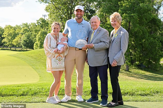 Scheffler and his family pose with Jack and Barbara Nicklaus after he lifted the trophy