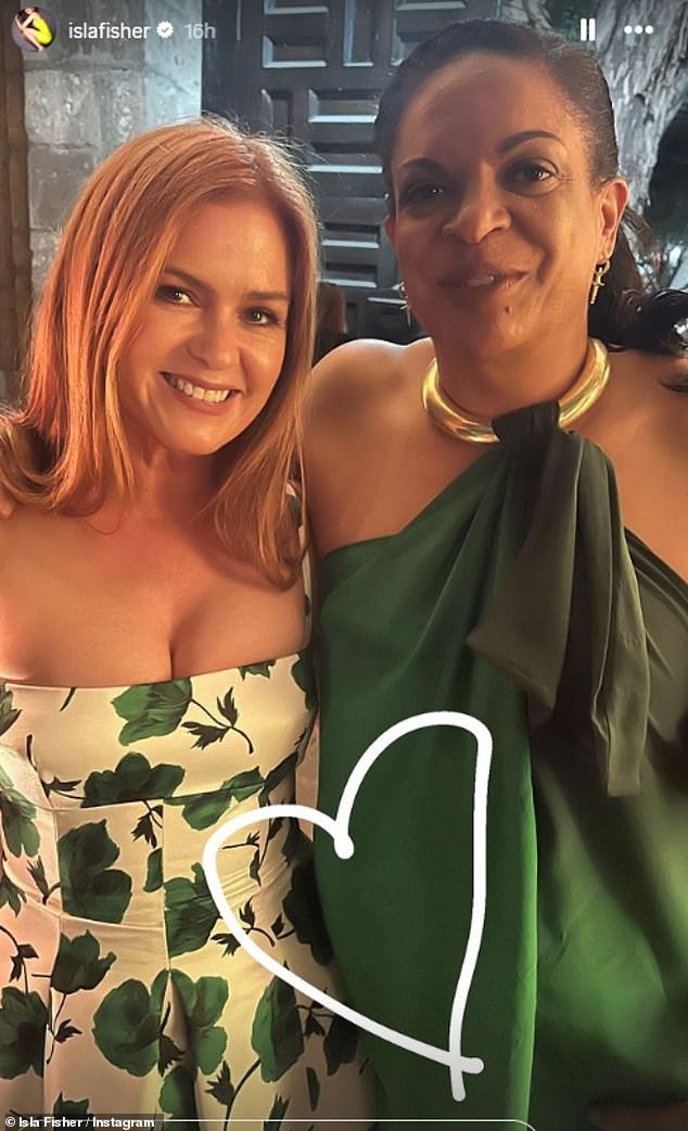 Newly single Isla Fisher was one of the celebrity guests in attendance and shared a series of photos from the wedding (pictured with a friend)