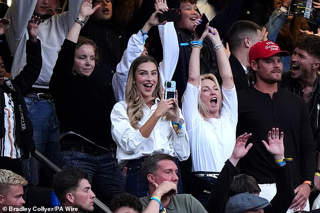 Zara was the epitome of chic as she happily supported Sam alongside his family in the stands