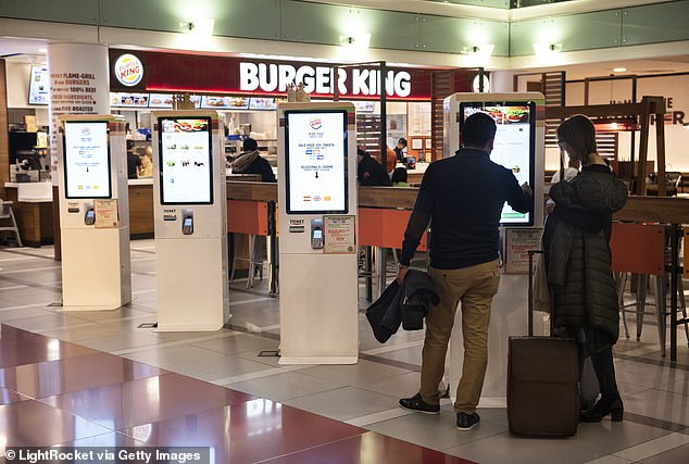 Critics warned that companies would turn to digital ordering kiosks as a way to reduce staff wage costs