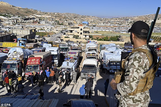 Syrian refugees gather as they prepare to leave the Arsal area, before their journey to their homes in Syria, in Arsal in the Bekaa Valley, Lebanon, May 14, 2024. Lebanese state media said on May 14 that about 330 Syrians in Lebanon their 'voluntary' repatriation from various areas of Lebanon.