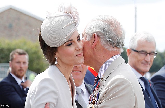 Charles greets Kate at a Commonwealth war cemetery in Ypres, Belgium, in July 2017