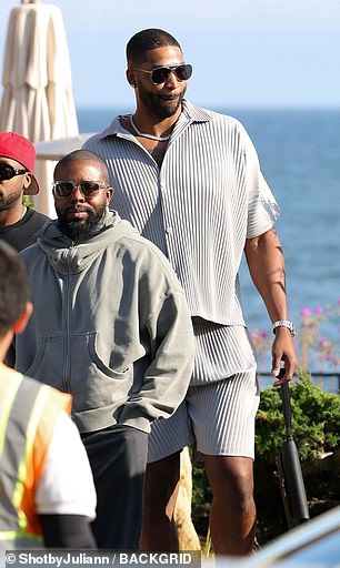 NBA star Tristan, 33, wore a striped shirt and shorts for the lunch date.