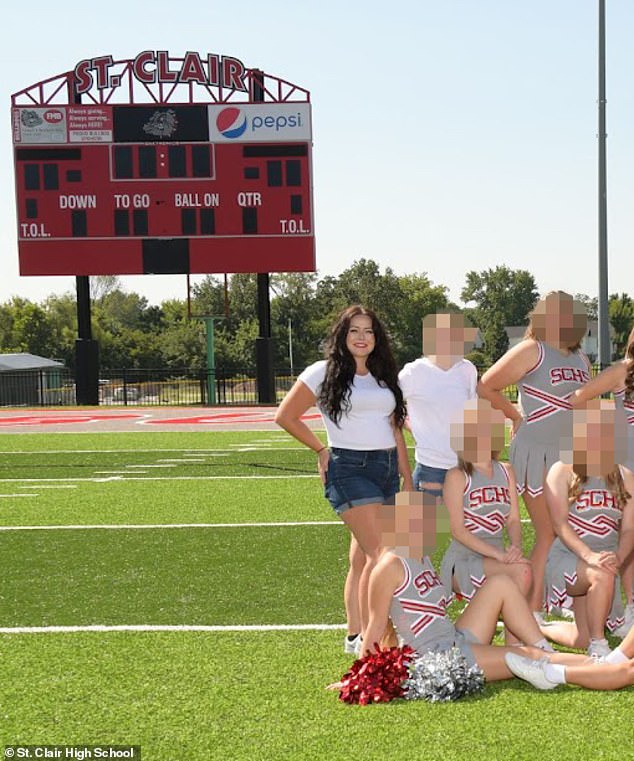Pictured: Gaiter with the St. Clair High School cheerleaders, whom she coached before her Only Fans scandal