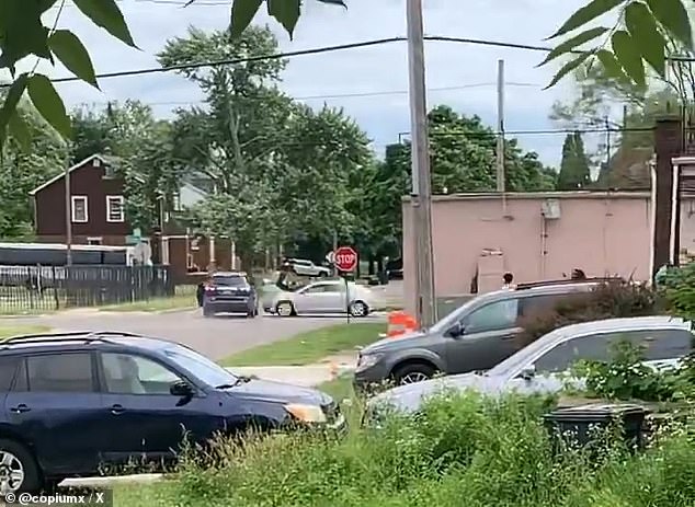 After throwing the items away, both women ran back into the car and ran away.  The driver ignored the stop sign before a car crashed into his vehicle