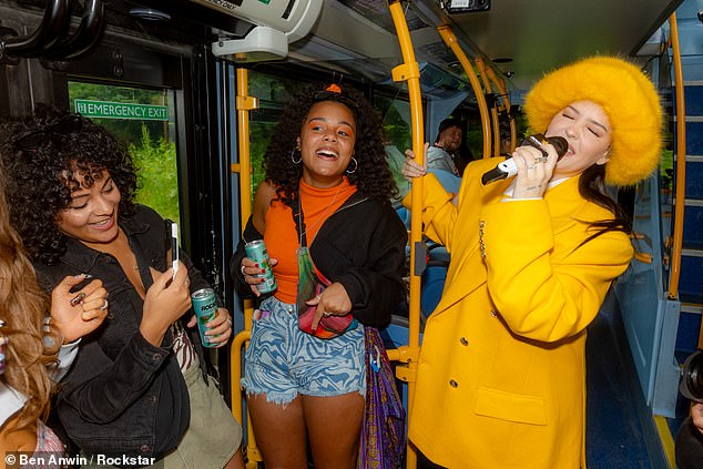 Fans couldn't believe their eyes when the bus made a surprise stop to pick up the superstar and took out their phones to take a photo to remember the monumental moment