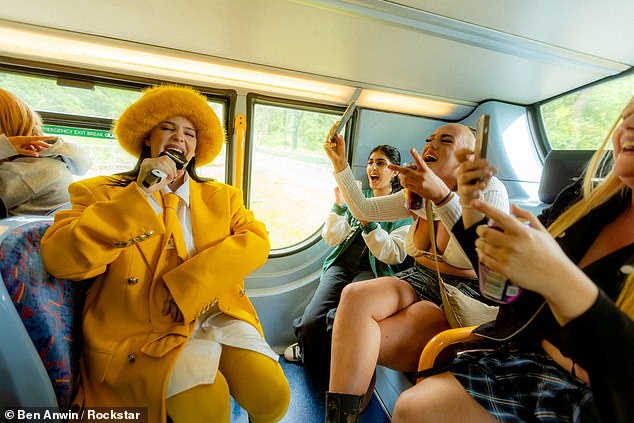 She treated the unsuspecting passengers to renditions of her well-known hits 2002 and Perfect