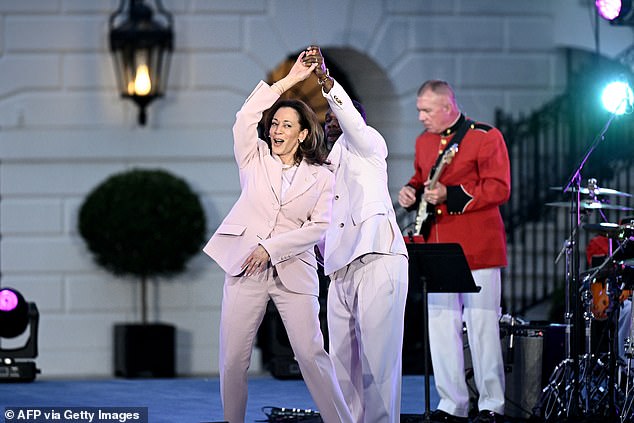 U.S. Vice President Kamala Harris dances with American singer Kirk Franklin during a Juneteenth concert on the South Lawn of the White House in Washington, DC on June 10, 2024