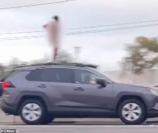 The woman raised her hands, took off her clothes and flashed stunned motorists, with some capturing the incident on their phones