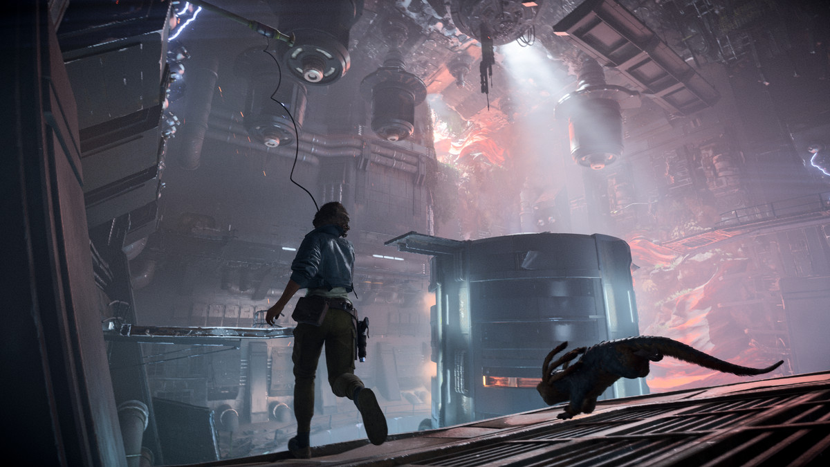in a screenshot from Star Wars Outlaws, Kay and her little alien pet Nix run away from the viewer, both in partial silhouette, as she shoots a grappling hook at a pole;  in the background there is a huge reactor