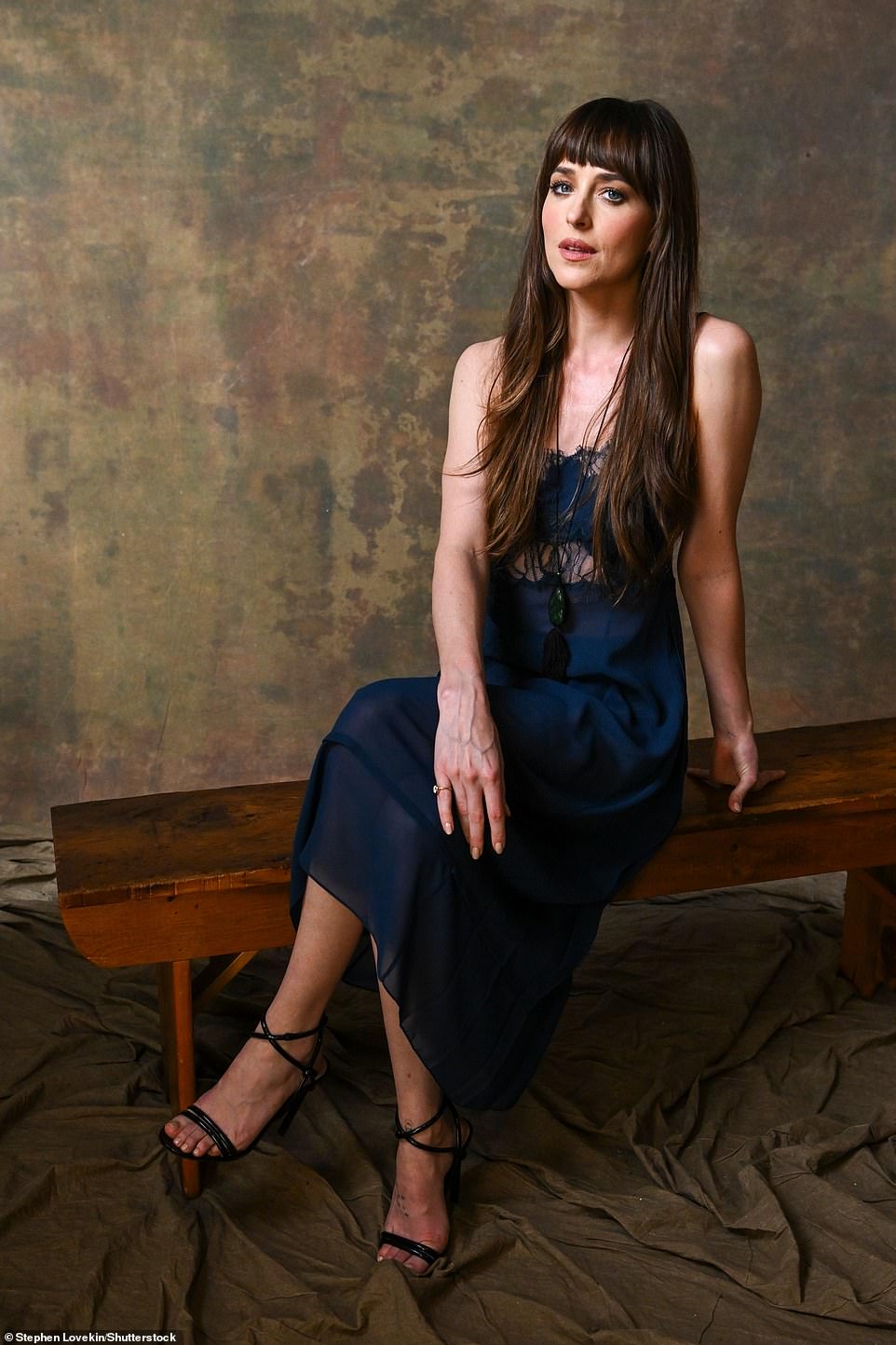 Johnson took a seat on a wooden bench for her portrait series