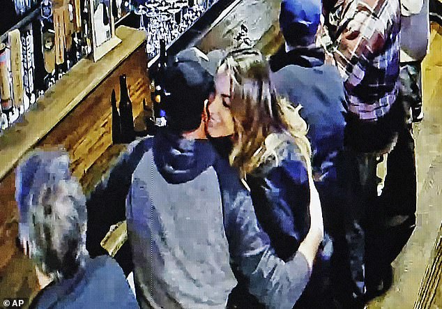 Chilling images of glamorous accused murderer Karen Read in a Boston bar on the night she allegedly murdered her police officer boyfriend have been shown in court