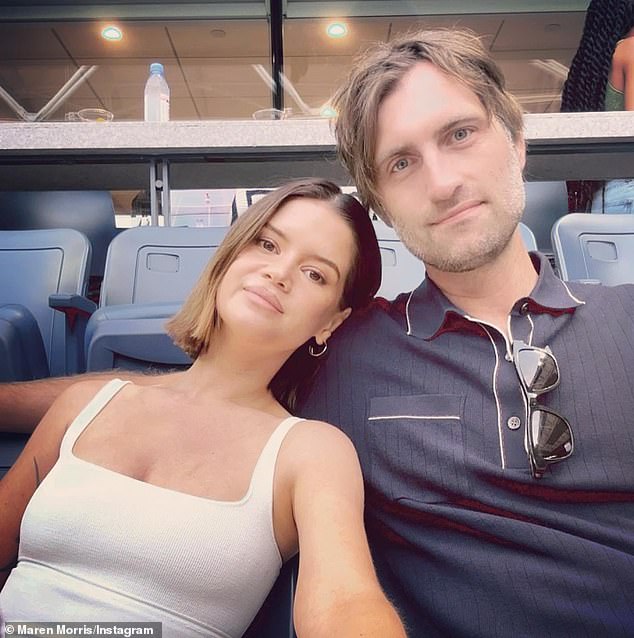 Morris' announcement came four months after she finalized her divorce from country crooner Ryan Hurd (R, pictured September 3), to whom she pays $2,100 in child support every month.