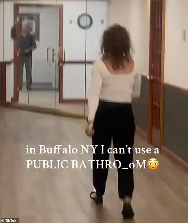 At the end of the video, the woman turns and walks to the security desk where she says she is making a report.