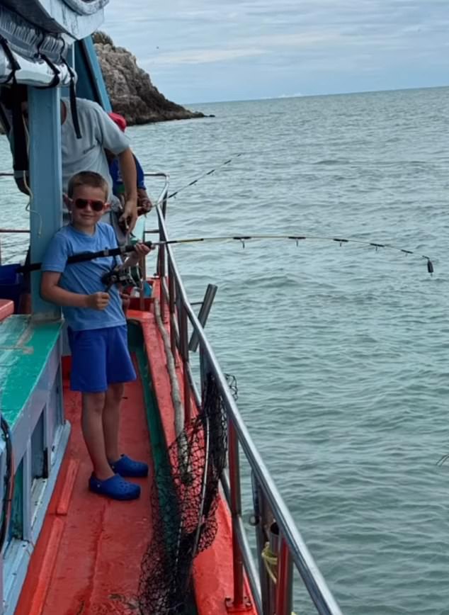 Jamie and Rebekah's son Finley enjoys fishing on a boat in Thailand