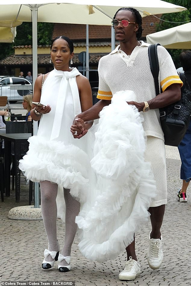 Rondo and Fitzgerald walked hand in hand as they matched in white for their celebration