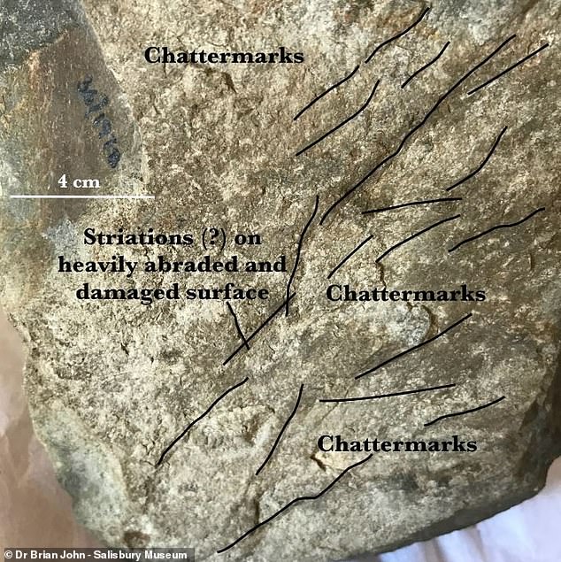 Dr.  Brian John, a retired geology lecturer at the University of Durham, claims that this bluestone boulder shows signs that it was moved by glacial ice