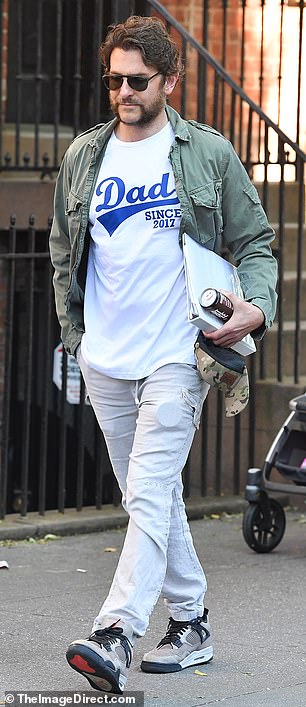 The star wore a white shirt with the words 'Dad Since 2017' printed on the front in blue letters