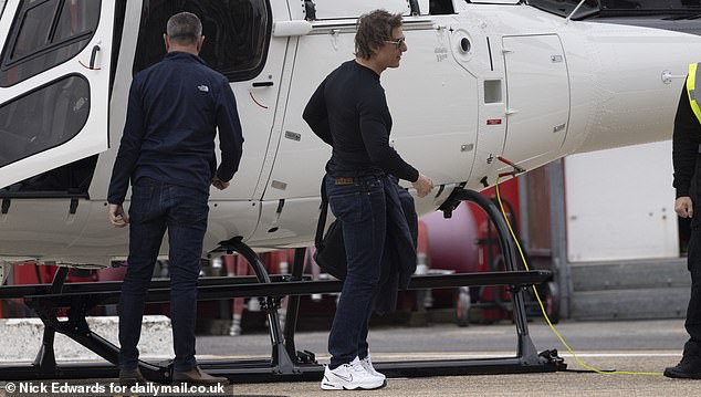 Tom appeared to have landed at the heliport with only the pilot for company in a small white plane