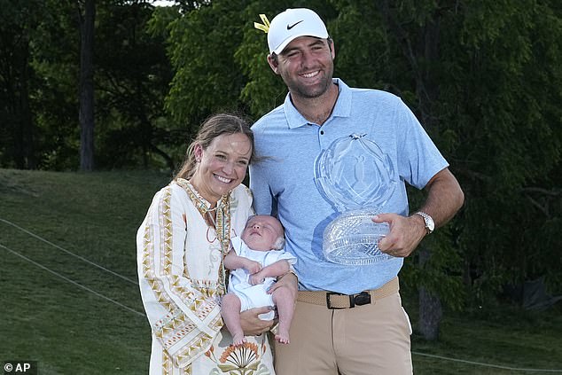 Scheffler poses with wife Meredith and son Bennett after winning the Memorial Tournament