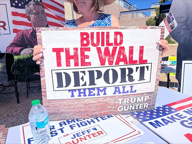 A Gunter supporter holds a sign outside a polling place in Las Vegas on Tuesday