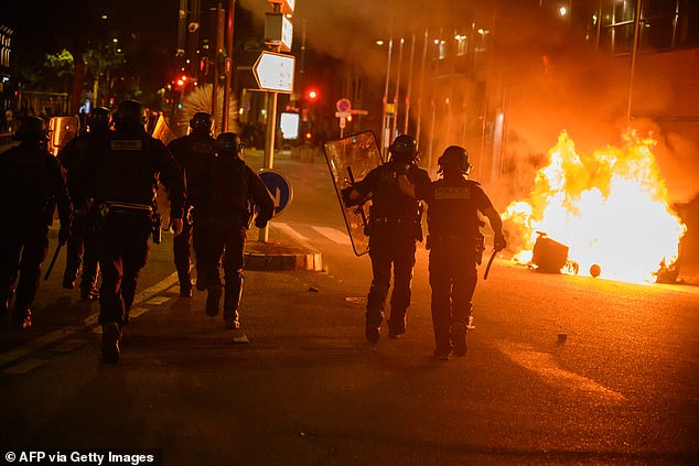 Police ignore burning of waste during 'anti-fascist rally' after European election results in Toulouse