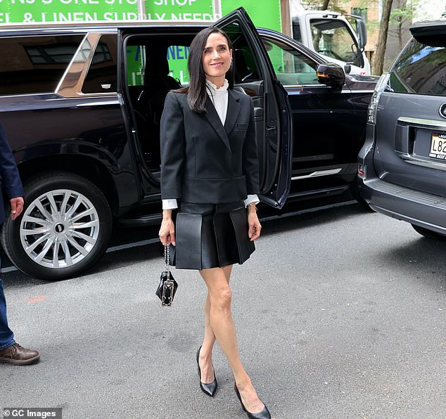 The star - who is an ambassador for the French brand - easily carried a black and silver wallet worth $3,850 in her right hand from Louis Vuitton