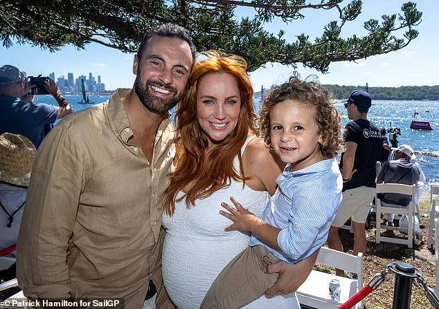 It comes after Robinson, 42, lifted the lid on her grueling battle with premenstrual dysphoric disorder (PMDD) as she prepares to welcome her second child with husband Cameron Merchant.  (L-R: Jules, Cameron and their son Ollie, four)