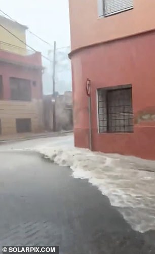 Water flooded the streets of Murcia on Monday as heavy rain hit Spain's southeastern region