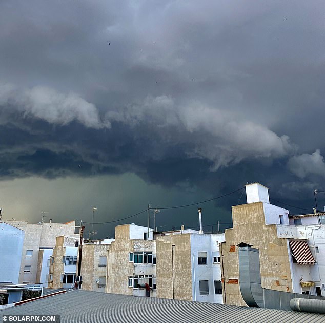 Thunderclouds are seen over the city of Murcia as rain and flooding hit the region