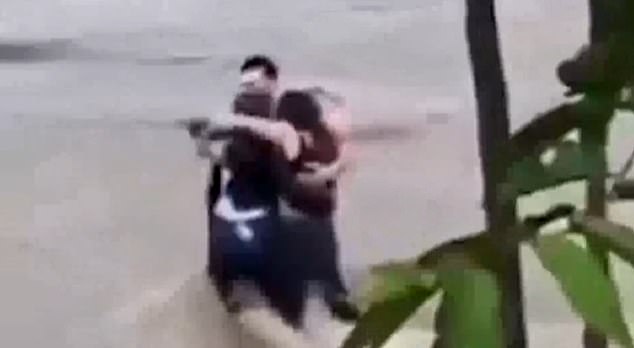 Spain is not the first Mediterranean country to be hit by extreme flooding this year, after Italy was also hit by flash floods at the end of May.  Pictured: The tragic moment three friends embraced for seconds before being swept away in the floods