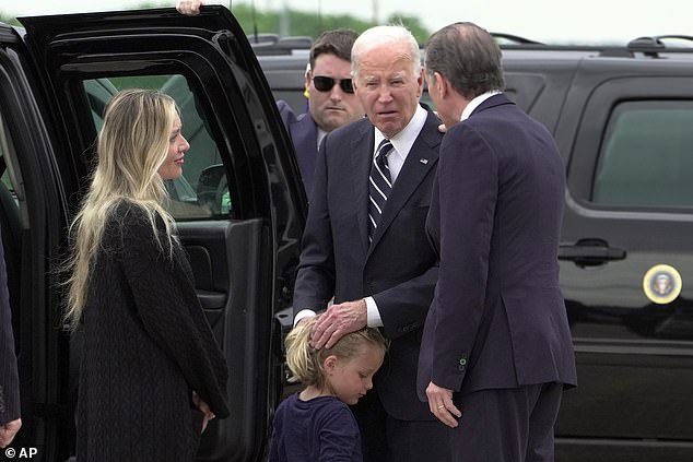 President Joe Biden (center) lingered on the tarmac to speak with Melissa Cohen (left), baby Beau (center) and Hunter Biden (right) after Hunter's sentencing