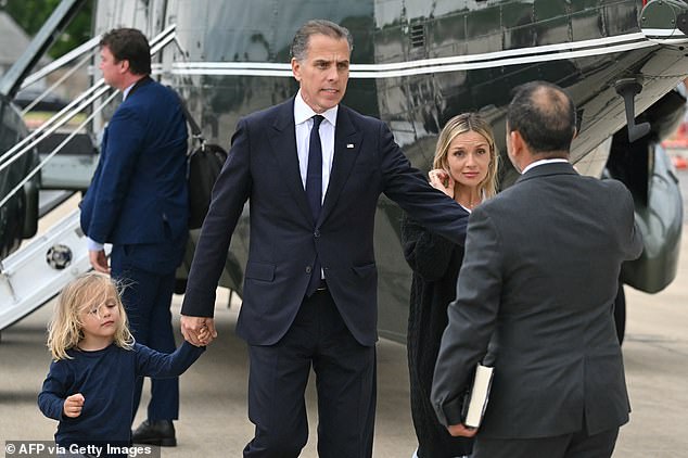 Hunter Biden (center) and Melissa Cohen (right) greet a White House aide as they walked to a separate car with their son Beau (left)