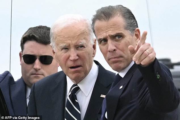 U.S. President Joe Biden talks with his son Hunter Biden upon arrival at the Delaware Air National Guard Base in New Castle, Delaware, on June 11, 2024