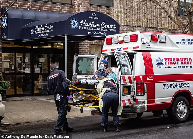 Medical workers tend to a patient outside the Harlem Center for Nursing and Rehabilitation in Harlem, New York, where at least 20 bodies were removed during the coronavirus pandemic and state data shows just five COVID-19 deaths on Wednesday, May 6, 2020