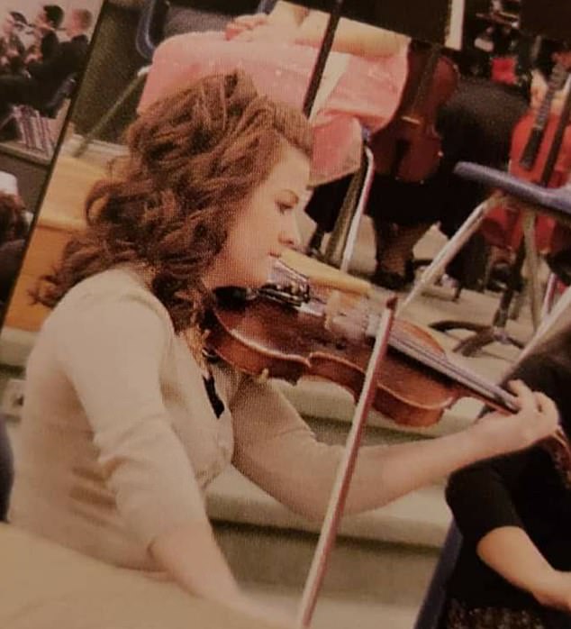 Growing up together in the same town, Moore says her days in elementary and middle school were often a struggle, feeling overwhelmed by nasty comments but still pursuing the violin.