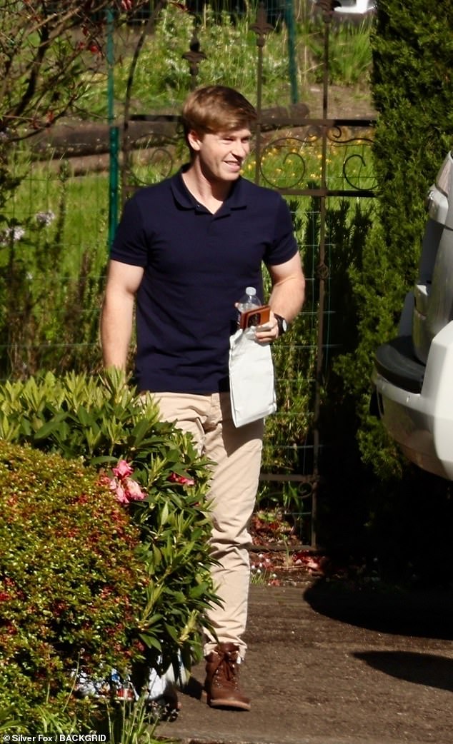 Meanwhile, Robert looked dapper in his navy blue polo shirt, teamed with tan trousers and brown sneakers