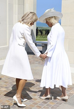 However, the queen seemed reluctant to offer her gloved hand