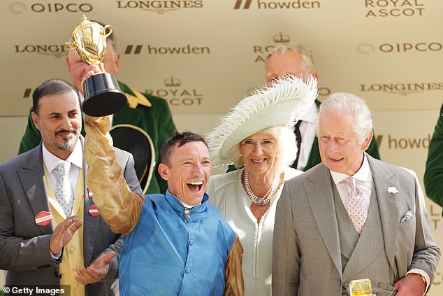 The jockey then stood in front of Camilla during the official photos