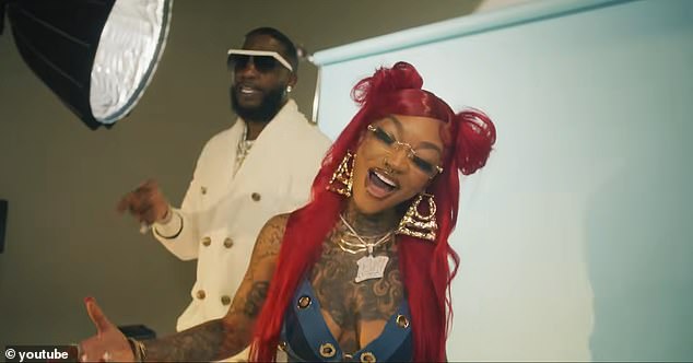 Enchanting and Gucci Mane pictured together in the music video for their collaborative song 'Issa Photoshoot'