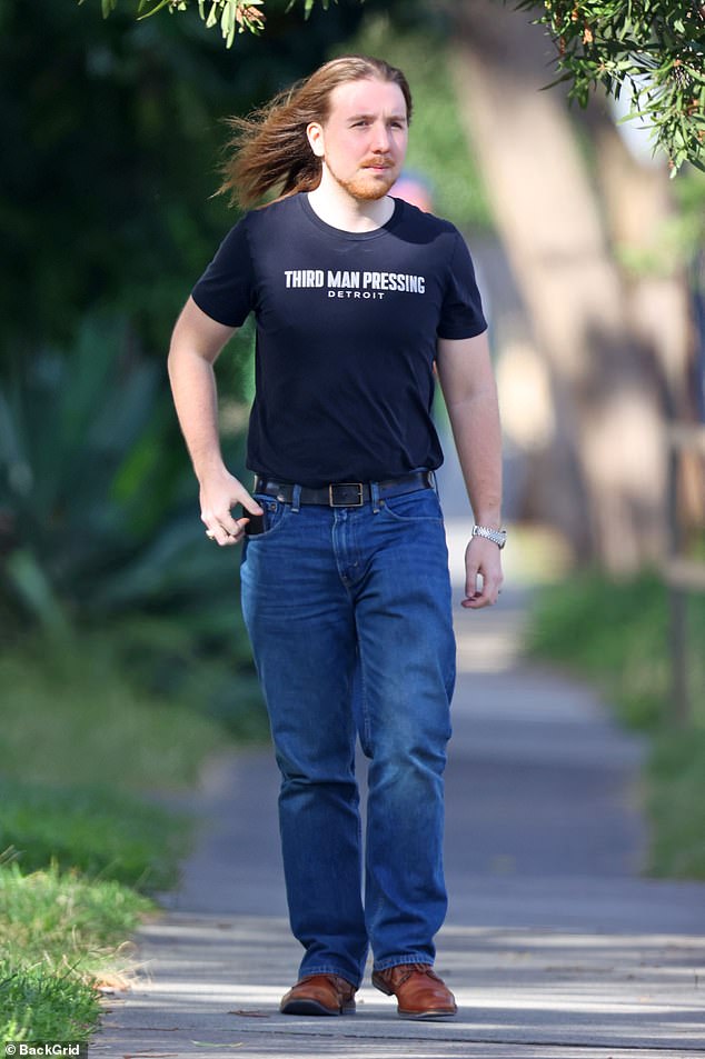 While running errands in Sydney's eastern suburbs, his heavy metal-inspired hair and edgy vibe turned heads.