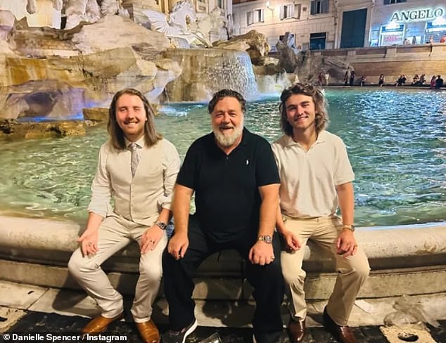 That's right, this stylish young man is none other than Russell Crowe's son Charles.  Pictured: Russell (center) and his two sons Charles (left) and Tennyson (right)