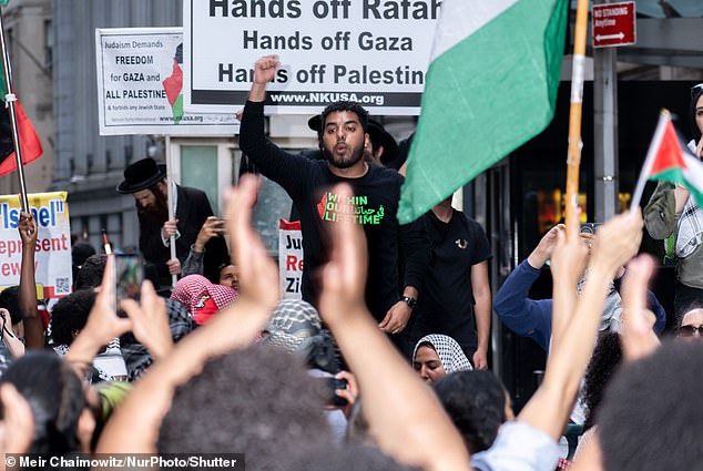 Pro-Palestinian protesters stop at the Nova Festival exhibition on Wall Street on Monday