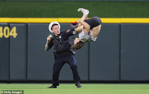 The man was wearing a Johnny Bench jersey and performed a perfect backflip as an officer approached