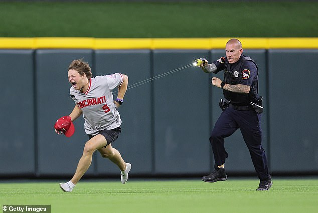 1718200339 474 Reds fan is tasered and tackled by police after storming