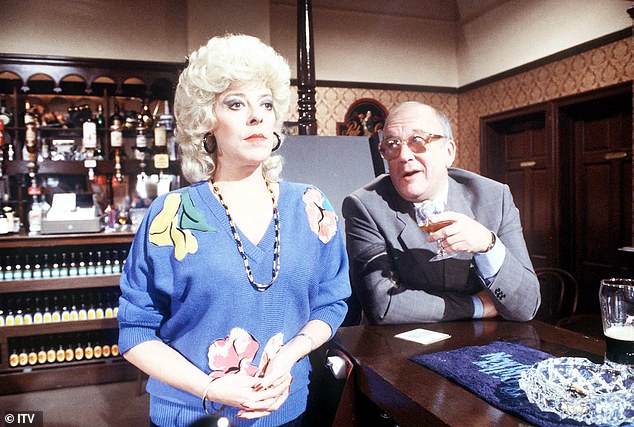 Julie's friend Mark Llewellin, who was the partner of her late co-star Roy Barraclough, spoke about his regular visits to see her on the Conversation Street podcast (Julie and Roy pictured on Corrie in 1986)